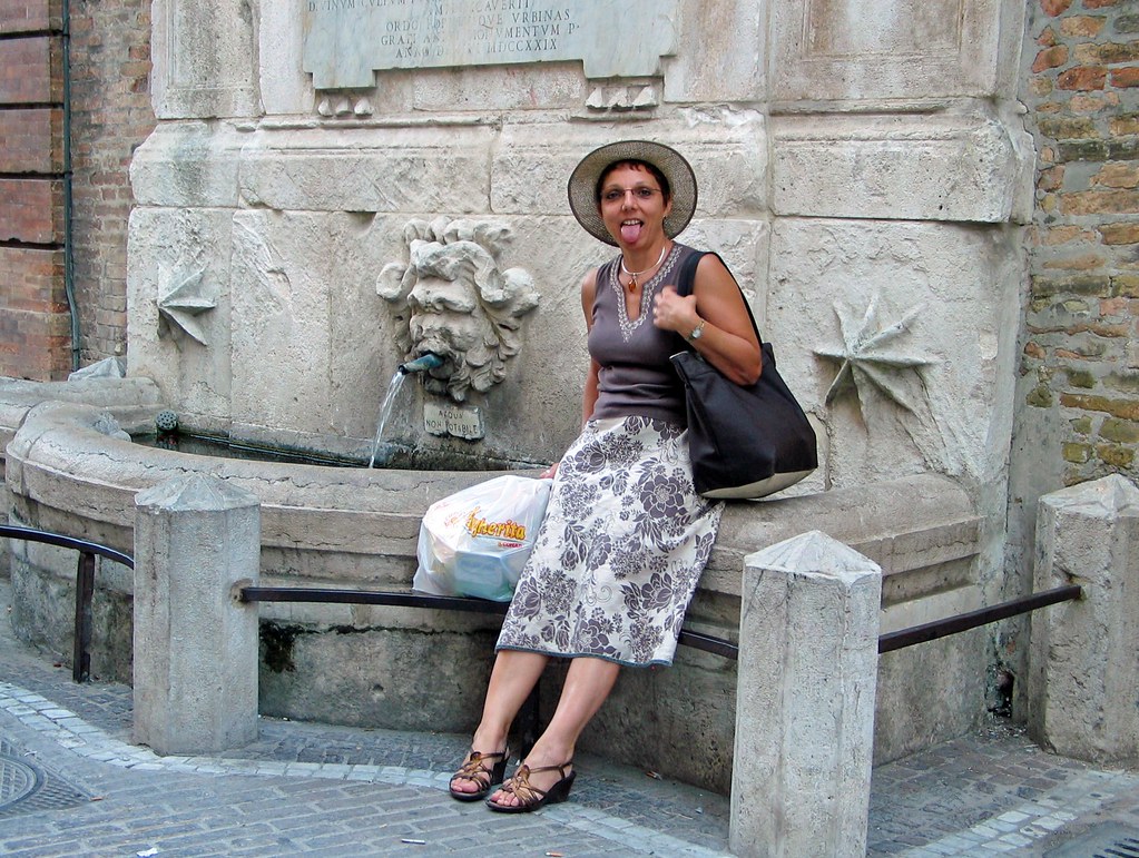 Woman drinking a glass of water as part of the Spanish Rapid Detox hydration routine